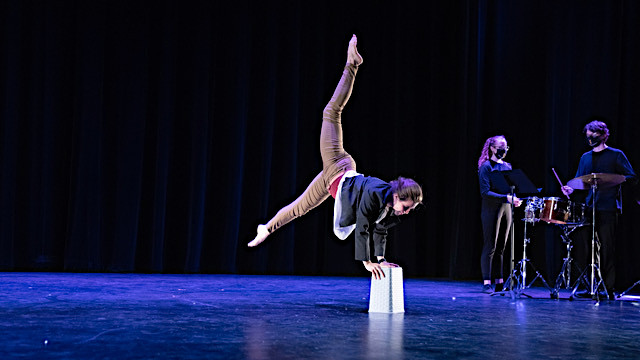 dancer with bucket on stage