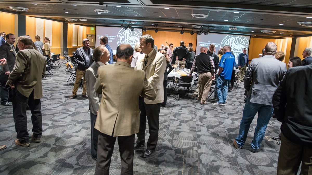 Attendees socialize at the U of I Alumni Awards ceremony held in the Vandal Ballroom